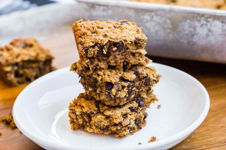 stack of three Peanut Butter Banana Oatmeal Bars on a white plate