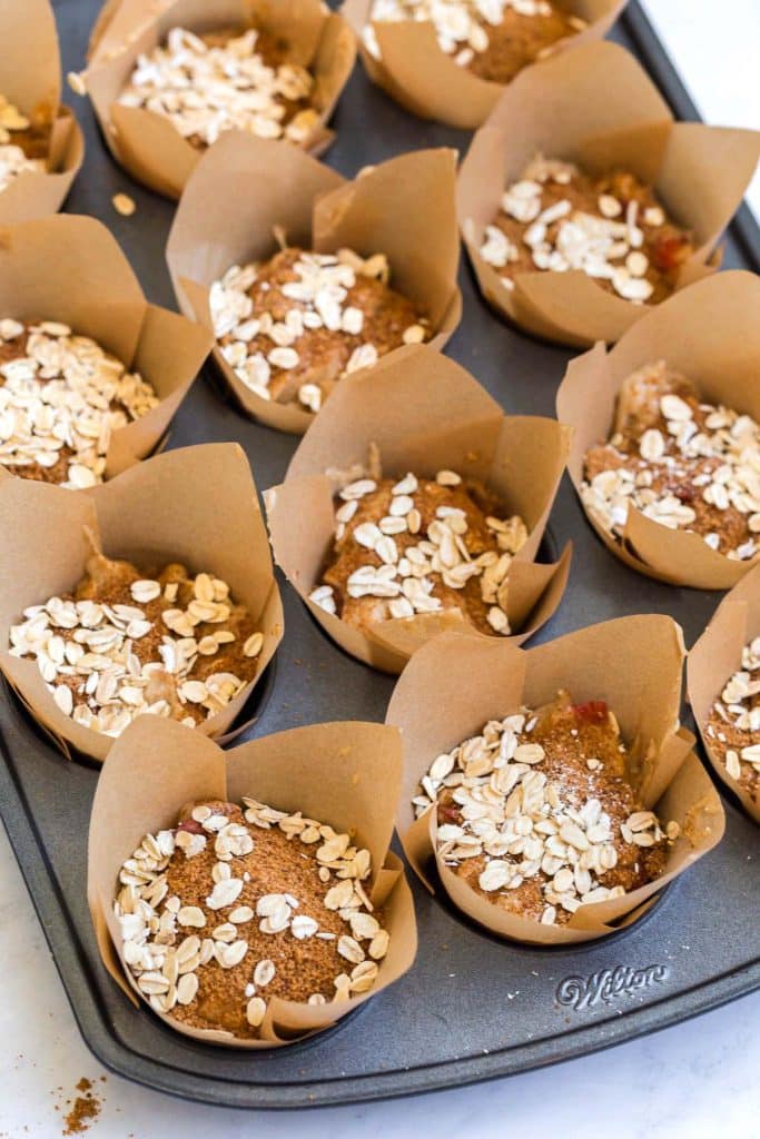 image of coconut sugar and oats sprinkled on top of uncooked muffins
