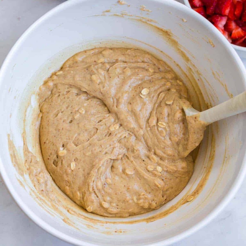 combined wet and dry ingredients in a white bowl