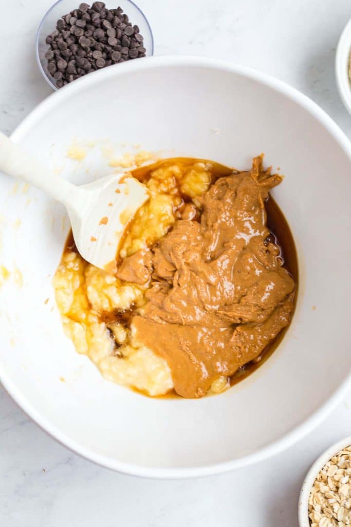 mashed banana, peanut butter, and vanilla in a white bowl