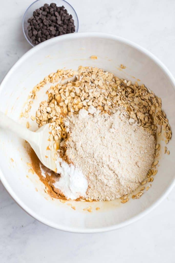 top down image of oats and flour in a white bowl