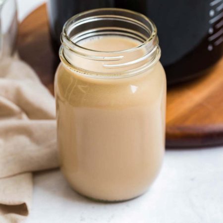image of homemade vanilla coffee creamer in a mason jar with no top