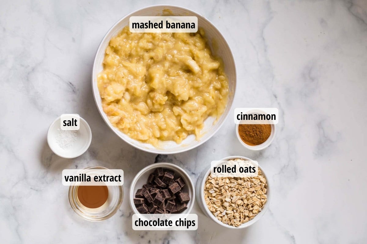Labeled ingredients in glass and white bowls on top of a white countertop.
